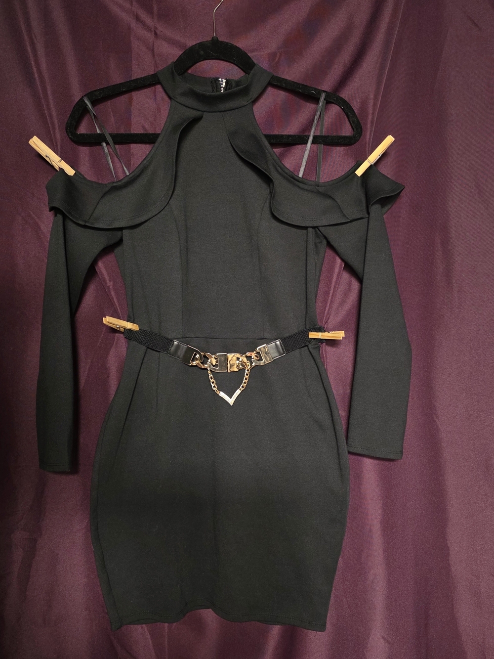 Black off the shoulder dress with gold chain belt and crystal-encrusted Bracelet